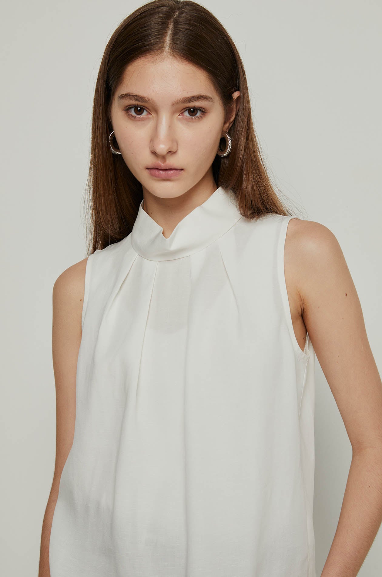 PLEATED MOCK NECK BLOUSE