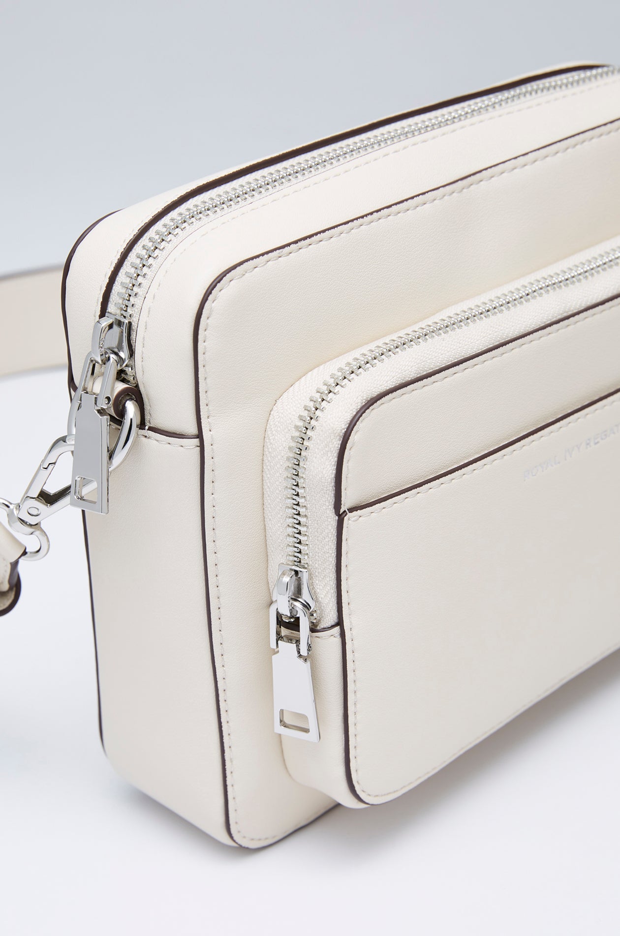 DEBOSSED LOGO ZIPPER CROSSBODY BAG